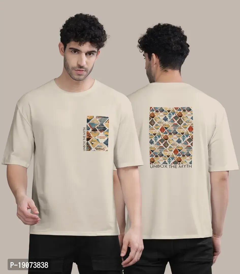 a man standing and wearing a beige color down shoulder t shirt of classyfad best t shirt store